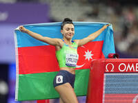 Lamiya Valiyeva of Azerbaijan celebrates winning gold in Women's 100m - T13 Final during the Paris 2024 Paralympic Games at Stade de France...