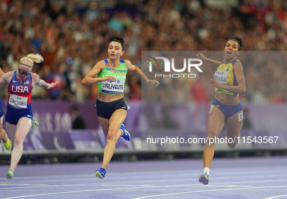 Lamiya Valiyeva of Azerbaijan celebrates winning gold in Women's 100m - T13 Final during the Paris 2024 Paralympic Games at Stade de France...