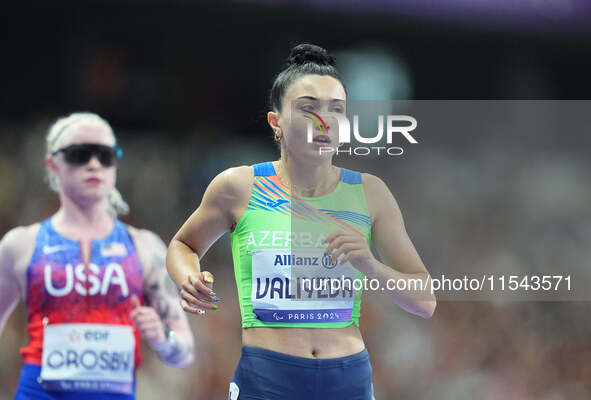 Lamiya Valiyeva of Azerbaijan celebrates winning gold in Women's 100m - T13 Final during the Paris 2024 Paralympic Games at Stade de France...