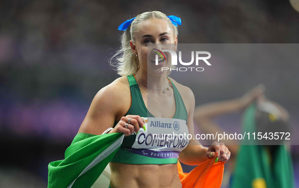 Orla Comerford of Ireland celebrates winning bronze in Women's 100m - T13 Final during the Paris 2024 Paralympic Games at Stade de France on...