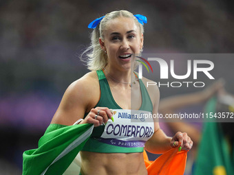 Orla Comerford of Ireland celebrates winning bronze in Women's 100m - T13 Final during the Paris 2024 Paralympic Games at Stade de France on...