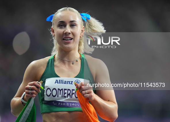 Orla Comerford of Ireland celebrates winning bronze in Women's 100m - T13 Final during the Paris 2024 Paralympic Games at Stade de France on...