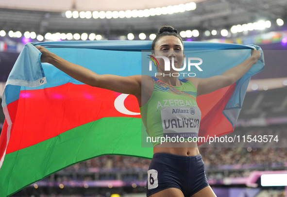 Lamiya Valiyeva of Azerbaijan celebrates winning gold in Women's 100m - T13 Final during the Paris 2024 Paralympic Games at Stade de France...