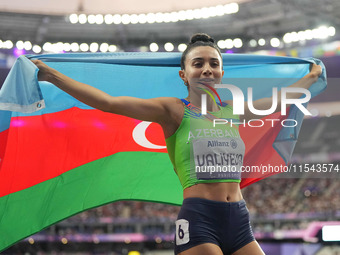 Lamiya Valiyeva of Azerbaijan celebrates winning gold in Women's 100m - T13 Final during the Paris 2024 Paralympic Games at Stade de France...