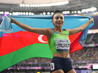 Lamiya Valiyeva of Azerbaijan celebrates winning gold in Women's 100m - T13 Final during the Paris 2024 Paralympic Games at Stade de France...