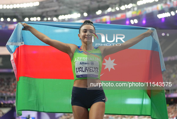 Lamiya Valiyeva of Azerbaijan celebrates winning gold in Women's 100m - T13 Final during the Paris 2024 Paralympic Games at Stade de France...