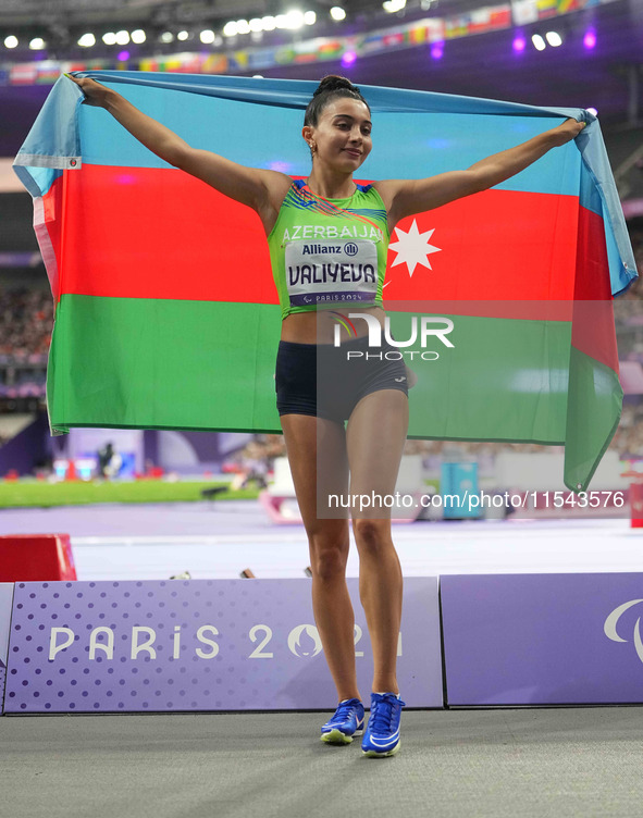 Lamiya Valiyeva of Azerbaijan celebrates winning gold in Women's 100m - T13 Final during the Paris 2024 Paralympic Games at Stade de France...