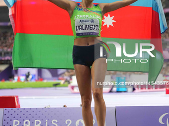 Lamiya Valiyeva of Azerbaijan celebrates winning gold in Women's 100m - T13 Final during the Paris 2024 Paralympic Games at Stade de France...