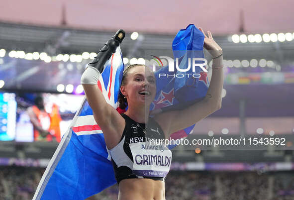 Anna Grimaldi of New Zealand celebrates winning bronze in Women's 100m - T47 Final during the Paris 2024 Paralympic Games at Stade de France...