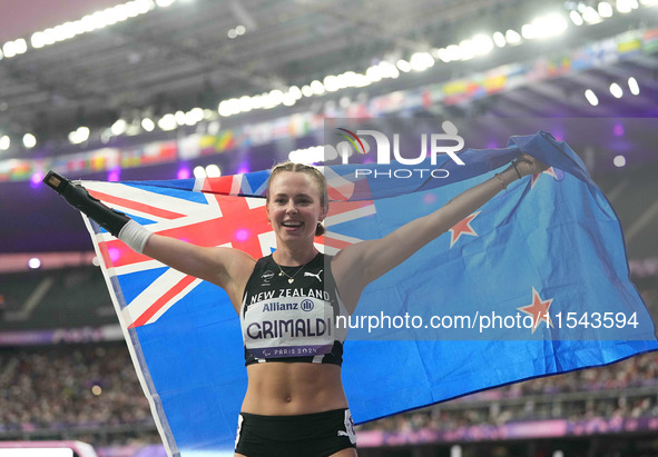 Anna Grimaldi of New Zealand celebrates winning bronze in Women's 100m - T47 Final during the Paris 2024 Paralympic Games at Stade de France...