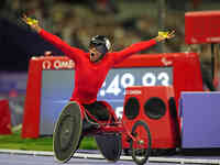 Hua Jin of People's Republic of China celebrates winning gold in Men's 1500m - T54 Final during the Paris 2024 Paralympic Games at Stade de...