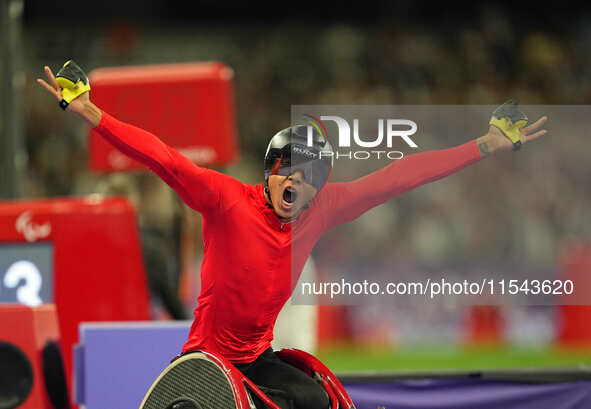 Hua Jin of People's Republic of China celebrates winning gold in Men's 1500m - T54 Final during the Paris 2024 Paralympic Games at Stade de...