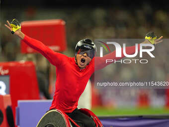 Hua Jin of People's Republic of China celebrates winning gold in Men's 1500m - T54 Final during the Paris 2024 Paralympic Games at Stade de...