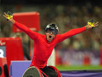 Hua Jin of People's Republic of China celebrates winning gold in Men's 1500m - T54 Final during the Paris 2024 Paralympic Games at Stade de...