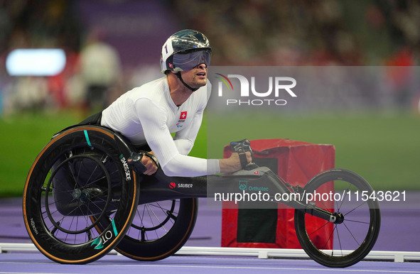 Marcel Hug of Switzerland celebrates winning silver in Men's 1500m - T54 Final during the Paris 2024 Paralympic Games at Stade de France on...