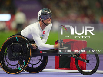 Marcel Hug of Switzerland celebrates winning silver in Men's 1500m - T54 Final during the Paris 2024 Paralympic Games at Stade de France on...