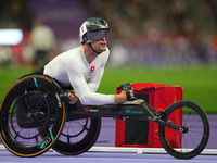 Marcel Hug of Switzerland celebrates winning silver in Men's 1500m - T54 Final during the Paris 2024 Paralympic Games at Stade de France on...