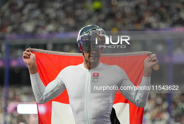 Marcel Hug of Switzerland celebrates winning silver in Men's 1500m - T54 Final during the Paris 2024 Paralympic Games at Stade de France on...