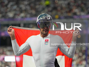 Marcel Hug of Switzerland celebrates winning silver in Men's 1500m - T54 Final during the Paris 2024 Paralympic Games at Stade de France on...