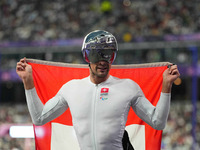 Marcel Hug of Switzerland celebrates winning silver in Men's 1500m - T54 Final during the Paris 2024 Paralympic Games at Stade de France on...