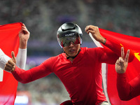 Hua Jin of People's Republic of China celebrates winning gold in Men's 1500m - T54 Final during the Paris 2024 Paralympic Games at Stade de...