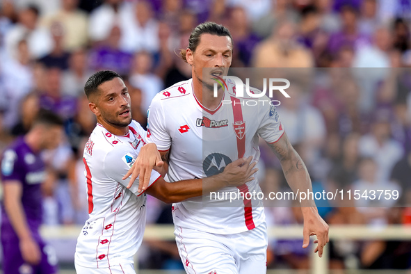 Milan Djuric of AC Monza celebrates with Gianluca Caprari after scoring first goal during the Serie A Enilive match between ACF Fiorentina a...