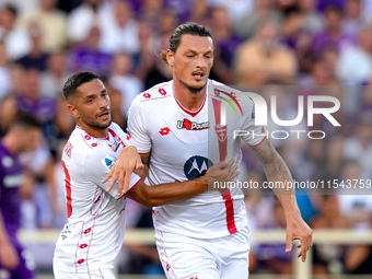 Milan Djuric of AC Monza celebrates with Gianluca Caprari after scoring first goal during the Serie A Enilive match between ACF Fiorentina a...