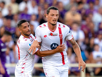 Milan Djuric of AC Monza celebrates with Gianluca Caprari after scoring first goal during the Serie A Enilive match between ACF Fiorentina a...