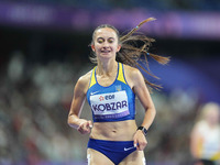 Nataliia Kobzar of Ukraine celebrates winning gold in Women's 400m - T37 Final during the Paris 2024 Paralympic Games at Stade de France on...