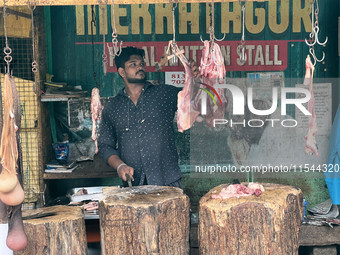 A butcher cuts meat at the Connemara market (Palayam Market) in Thiruvananthapuram, Kerala, India, on April 13, 2024. The Connemara market (...