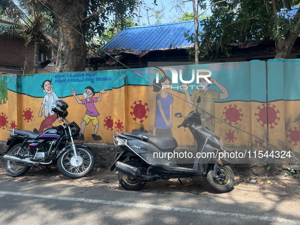 A mural promotes protection against the novel coronavirus (COVID-19) in Thrikkadavoor, Kerala, India, on April 6, 2024. 