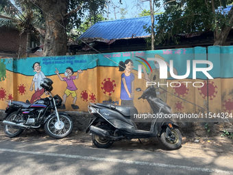 A mural promotes protection against the novel coronavirus (COVID-19) in Thrikkadavoor, Kerala, India, on April 6, 2024. (