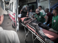 A number of martyrs and wounded, most of them children, arrive at the Arab High Hospital from different areas of Gaza City on September 3, 2...