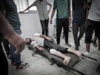 A number of martyrs and wounded, most of them children, arrive at the Arab High Hospital from different areas of Gaza City on September 3, 2...