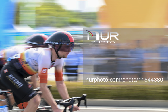 Participants ride during the 12th Round of the Poyang Lake International Cycling Competition in Leping, China, on September 3, 2024. 