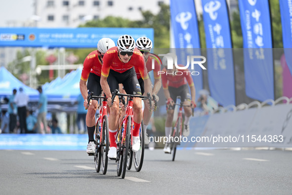 Participants ride during the 12th Round of the Poyang Lake International Cycling Competition in Leping, China, on September 3, 2024. 