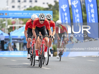 Participants ride during the 12th Round of the Poyang Lake International Cycling Competition in Leping, China, on September 3, 2024. (