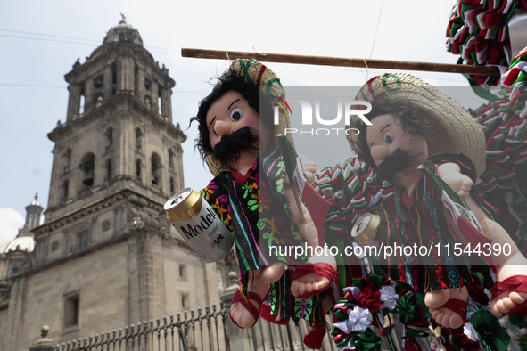 Sale of dolls takes place on Tuesday, September 3, 2024, in the Zocalo of Mexico City, Mexico, on the eve of Mexico's Independence Day, whic...