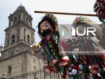 Sale of dolls takes place on Tuesday, September 3, 2024, in the Zocalo of Mexico City, Mexico, on the eve of Mexico's Independence Day, whic...