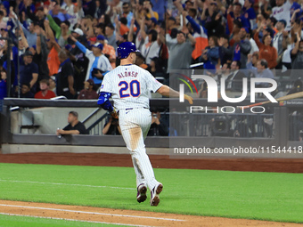 Pete Alonso #20 of the New York Mets tosses his bat after homering during the eighth inning of the baseball game against the Boston Red Sox...