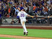 Pete Alonso #20 of the New York Mets tosses his bat after homering during the eighth inning of the baseball game against the Boston Red Sox...