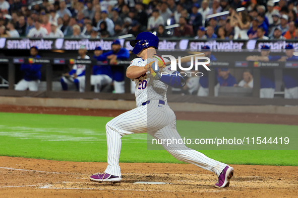 Pete Alonso #20 of the New York Mets singles during the sixth inning of the baseball game against the Boston Red Sox at Citi Field in Corona...