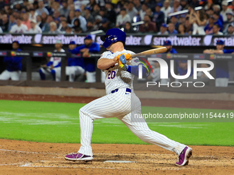 Pete Alonso #20 of the New York Mets singles during the sixth inning of the baseball game against the Boston Red Sox at Citi Field in Corona...