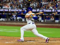 Pete Alonso #20 of the New York Mets singles during the sixth inning of the baseball game against the Boston Red Sox at Citi Field in Corona...