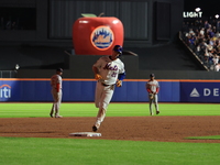 Pete Alonso #20 of the New York Mets rounds the bases after homering during the eighth inning of the baseball game against the Boston Red So...