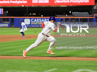 New York Mets Francisco Alvarez #4 scores on a sacrifice fly during the eighth inning of the baseball game against the Boston Red Sox at Cit...