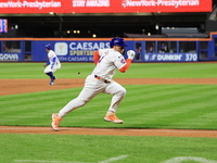 New York Mets Francisco Alvarez #4 scores on a sacrifice fly during the eighth inning of the baseball game against the Boston Red Sox at Cit...