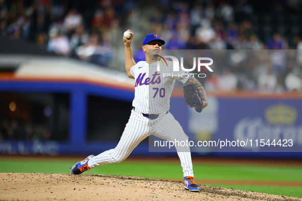 New York Mets relief pitcher Jose Butto #70 throws during the seventh inning of the baseball game against the Boston Red Sox at Citi Field i...