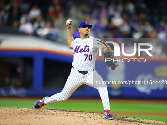 New York Mets relief pitcher Jose Butto #70 throws during the seventh inning of the baseball game against the Boston Red Sox at Citi Field i...