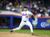 New York Mets relief pitcher Jose Butto #70 throws during the seventh inning of the baseball game against the Boston Red Sox at Citi Field i...